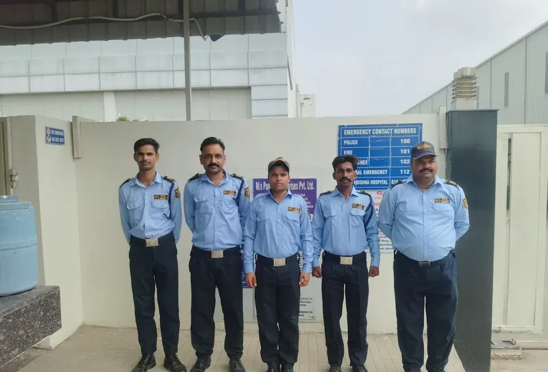 VSS security guards in blue uniforms at a site entrance
